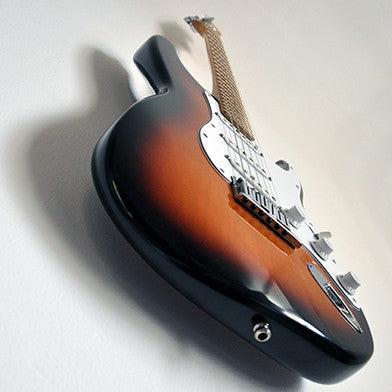 Fender Stratocaster on the wall with invisible wall guitar hanger